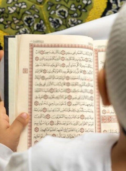 Person with Quran